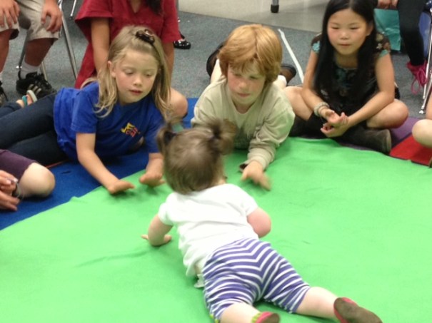 Second graders interacting with a baby in a Seattle Roots of Empathy session.