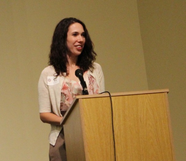 Amy West, Child Welfare Policy Coordinator presenting the Roots of Justice Award to Project Everlast.