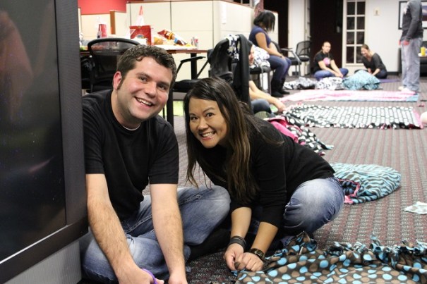 PE Lincoln Youth Advisor James Bowers and Employment Manager Oanh Heiser stop working to cheese it up.