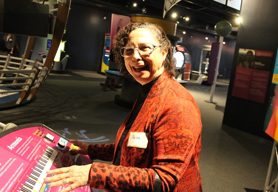 NCFF board member Marta Nieves learning about the math behind music.