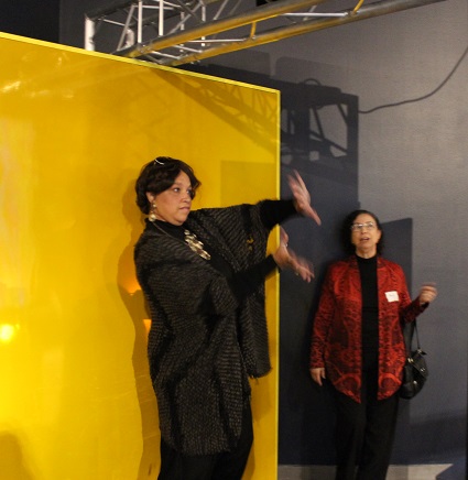 NET's Martha Florence dances in front of a motion sensing screen.