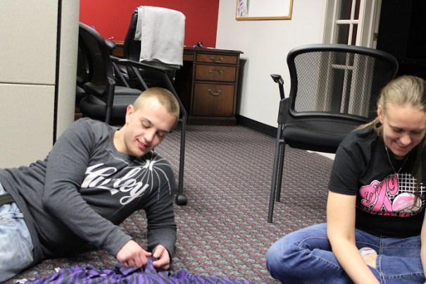 PE youth and adult volunteers work together to finish a few last blankets.