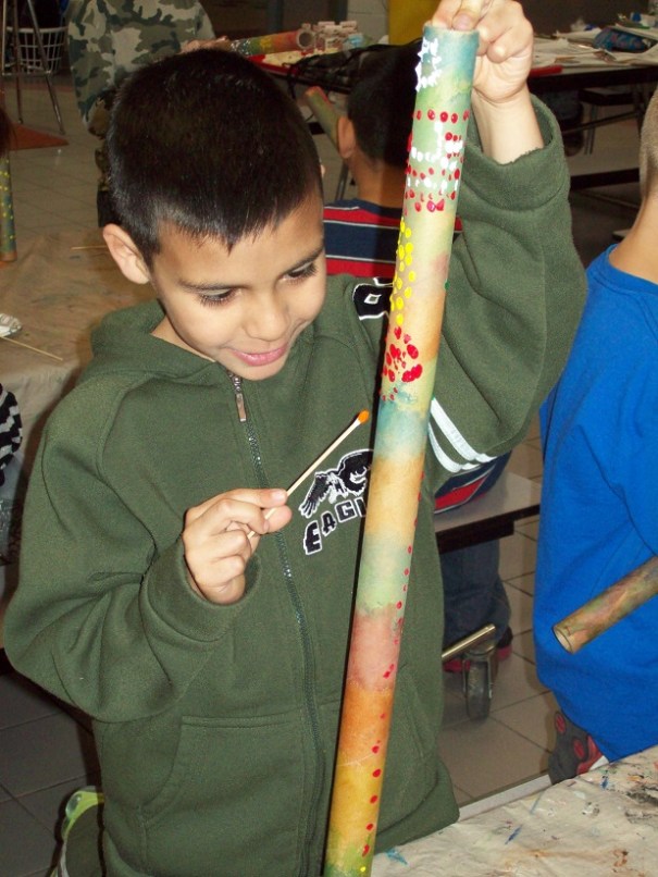 Student in Crete creating his own Didgeridoo.