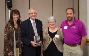Senator John Harms with his wife and kids.