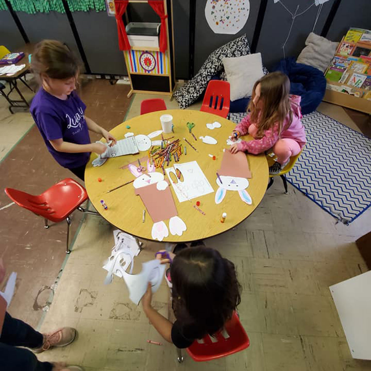 Children at Chantel Tonkinson's early care center, Ladybug Crossing, create Easter projects before Chantel temporarily closed the facility for her big move and a new beginning.