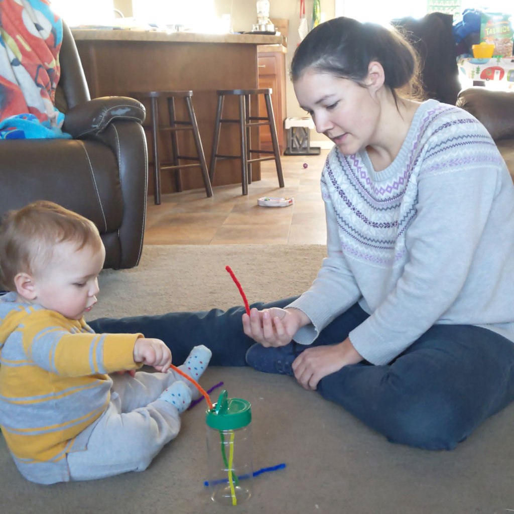 Cassie Boyle, (right), plays with her baby.