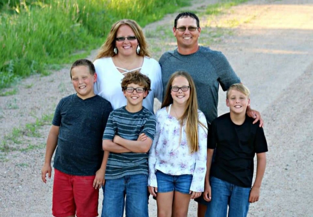 Here's Rachel with her quadruplets and her husband!