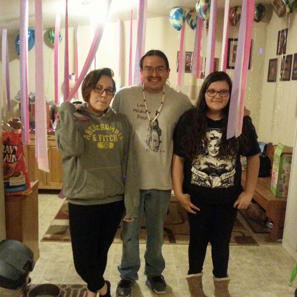 Edison Red Nest (middle), poses with his family. Shawna said she and her community have been inspired by his contributions.