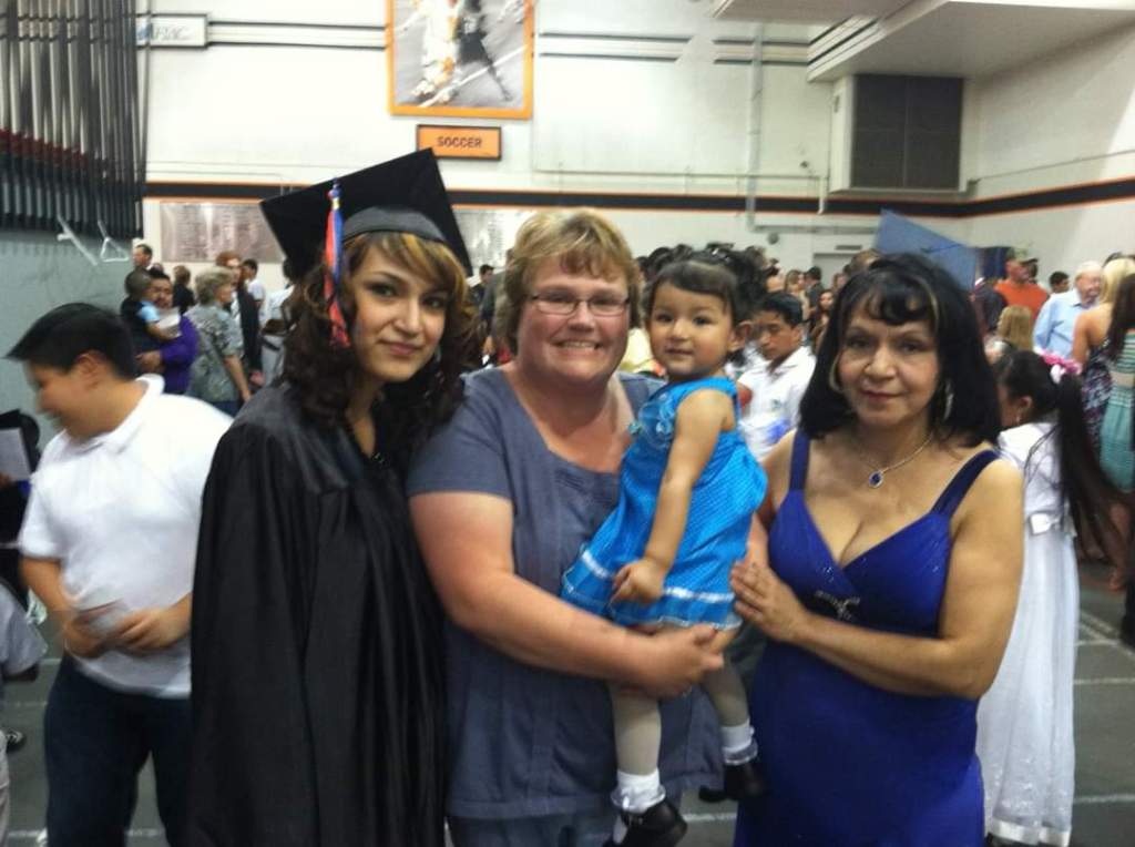 Yecenia achieved her goal: she graduated high school! Here, she poses with (l to r) her Sixpence home visitor, daughter, and mother.