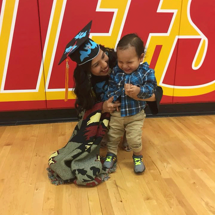 One of Lacey's first high school parents, Destiny Hastings (l), pictured with her son, Jasiah, at her high school graduation in 2018. She is currently a paraeducator at Shinga Zhinga Child Development Center.