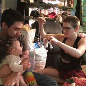 Ember (right) is one of home visitor Janelle's families. Here, Ember plays with their child while providing a developmentally engaging experience! 