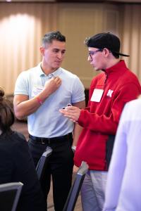 Nikolai Maly (right) talks with Felipe Longoria, Deputy Executive Director at Central Plains Center for Services. 