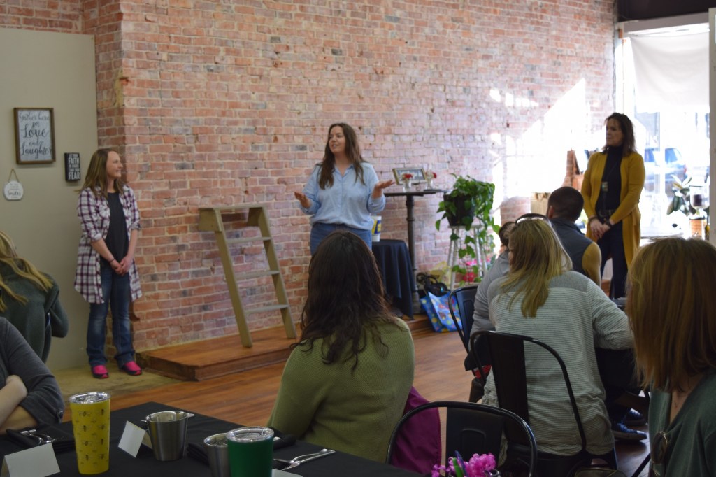 “We wanted to bring everyone together," said Katie (m). Here she is, center stage with her partners at the providers' event! 