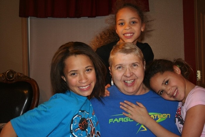 Tyeisha Thompson (l) is pictured with her sisters and grandmother. (2013) 