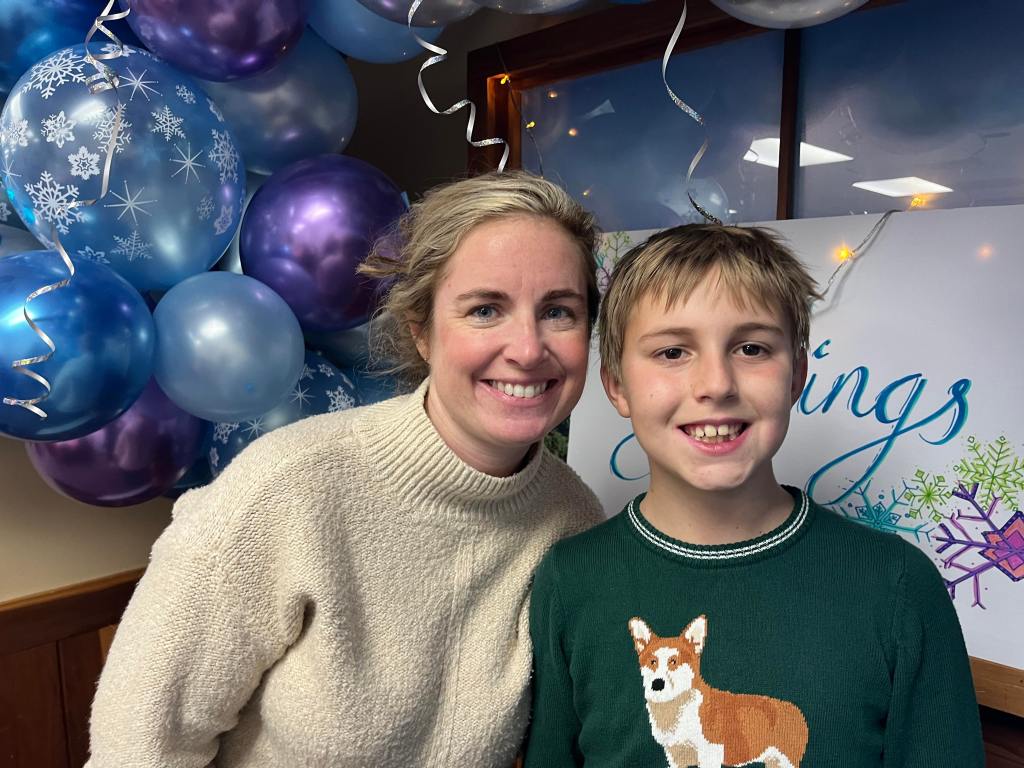 Jami and Bennet smiling at the camera.