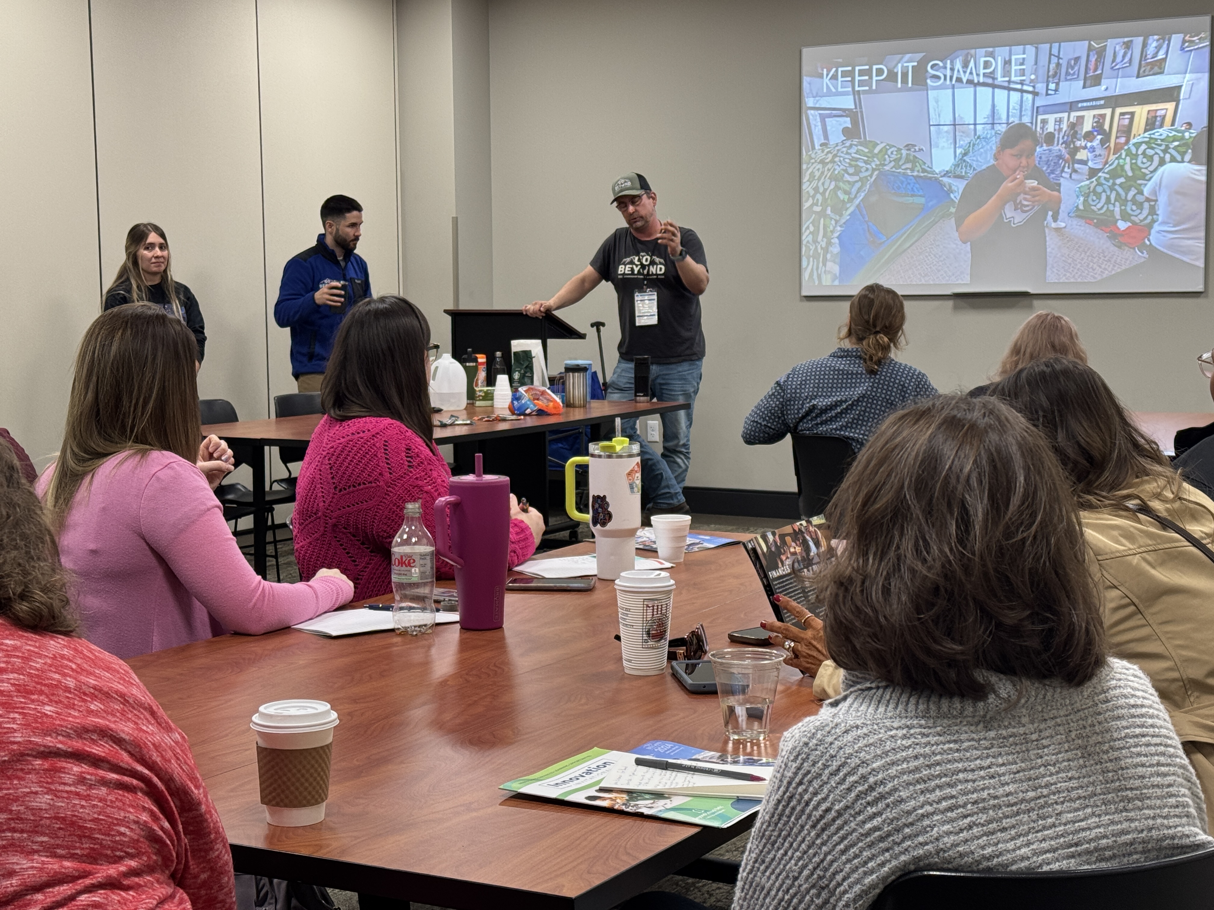 Group of three individuals present during Innovation Invitational.