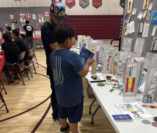 Three Girls Holding Books